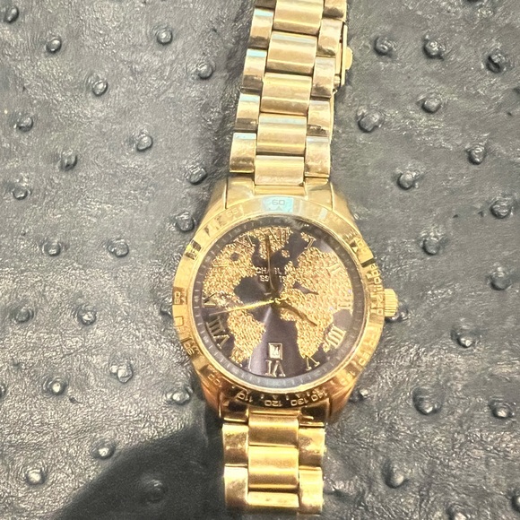 Used Michael Kors gold watch with blue background and map diamonds. - Picture 4 of 4